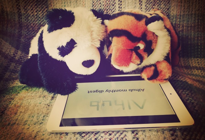 Panda and tiger reading