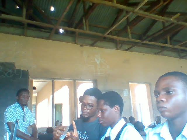 Four people in a room recording sign language