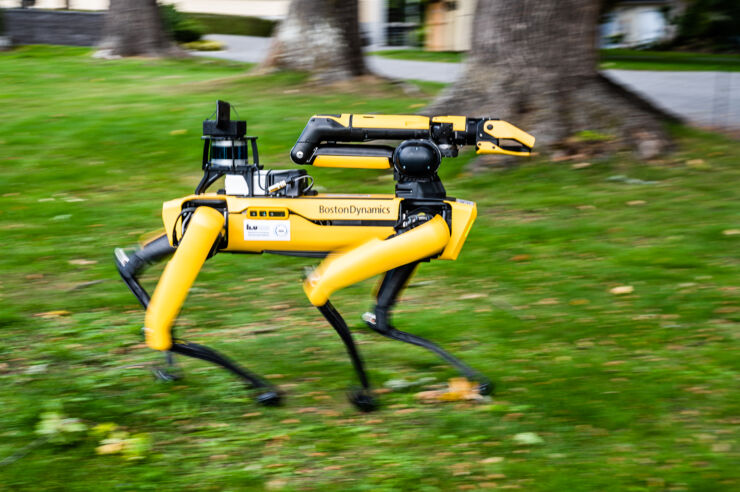 Yellow quadruped robot walking