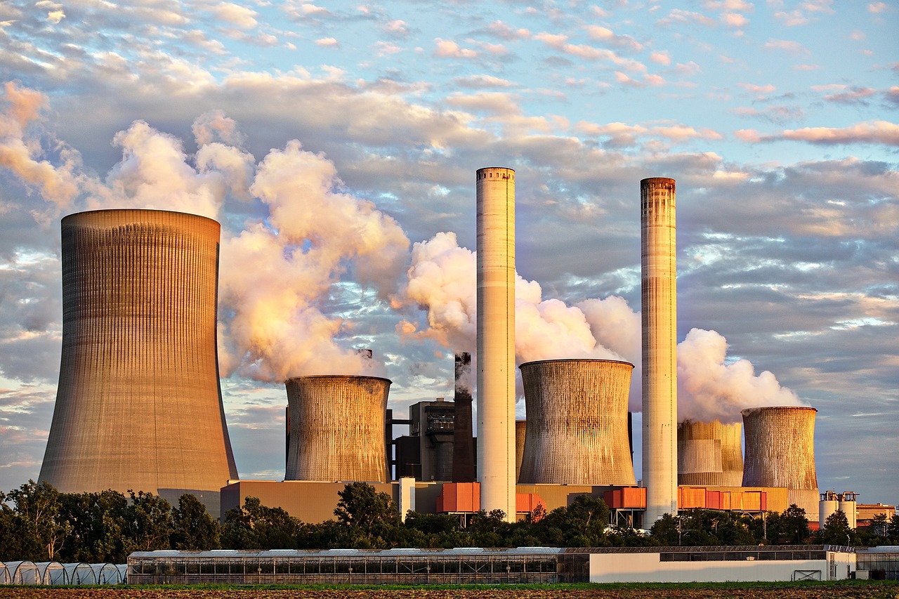 coal power plant with chimneys belching smoke