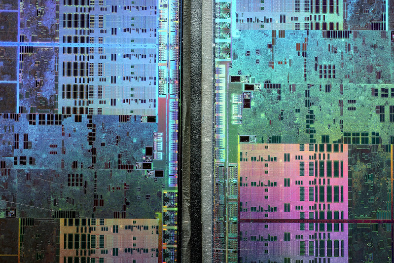 Abstract microscopic photography of a Graphics Processing Unit resembling a satellite image of a big city