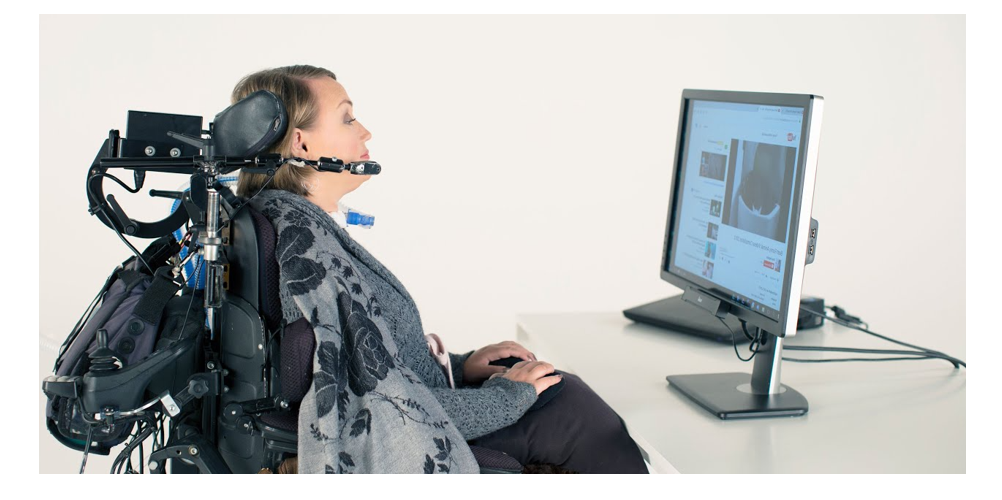 person sat in front of a computer using gaze tracking