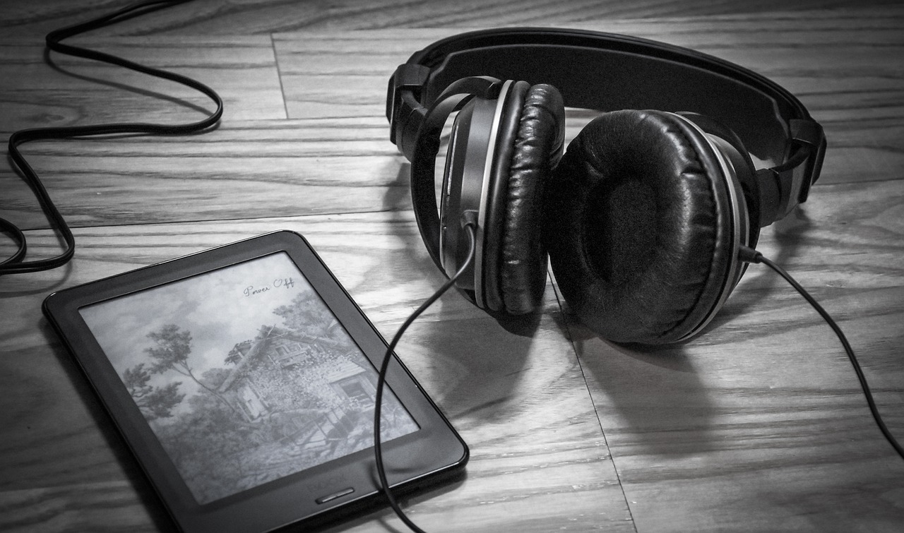 kindle and headphones on a table