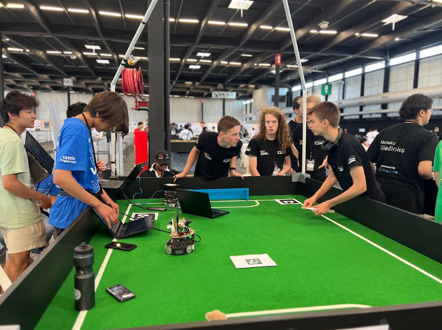 two teams setting up their robots