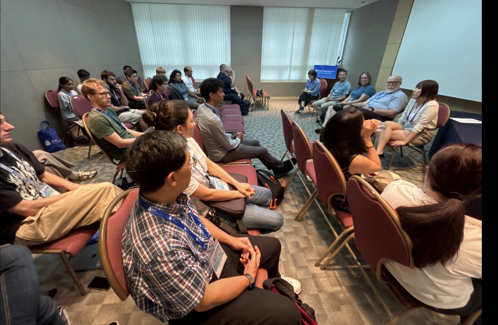 Audience watching a panel discussion